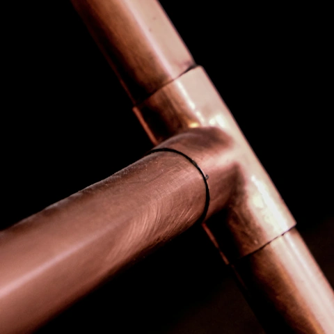 Copper pipe connected with a tee. Credit: Magda Ehlers / Pexels